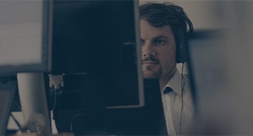 A SimScale employee at his workstation. Click to access the SimScale data Security.