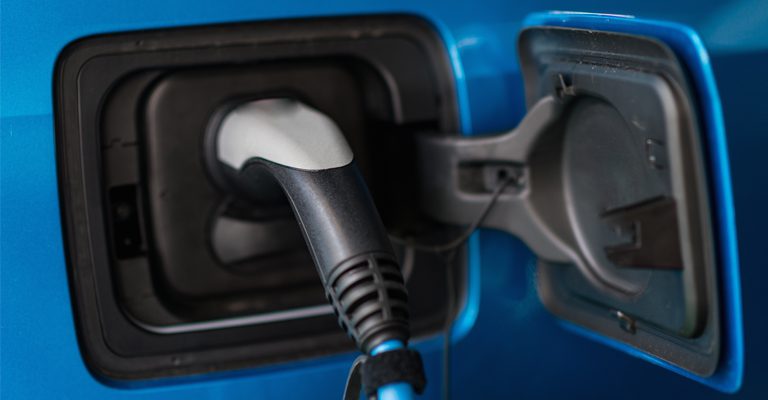 battery cooling for electric vehicles article showing an electric car charging