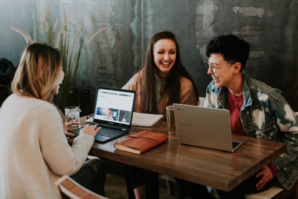 workers working remotely at a cafe