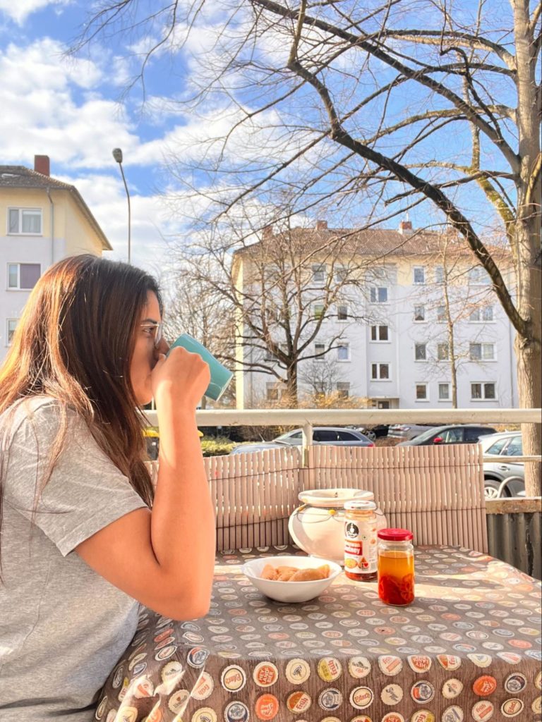 smriti eating lunch on balcony