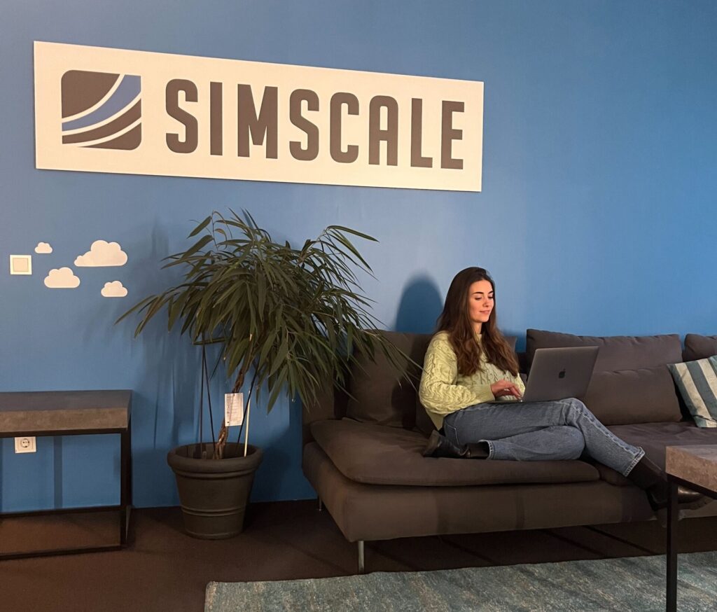 victoria working on the couch at the munich office