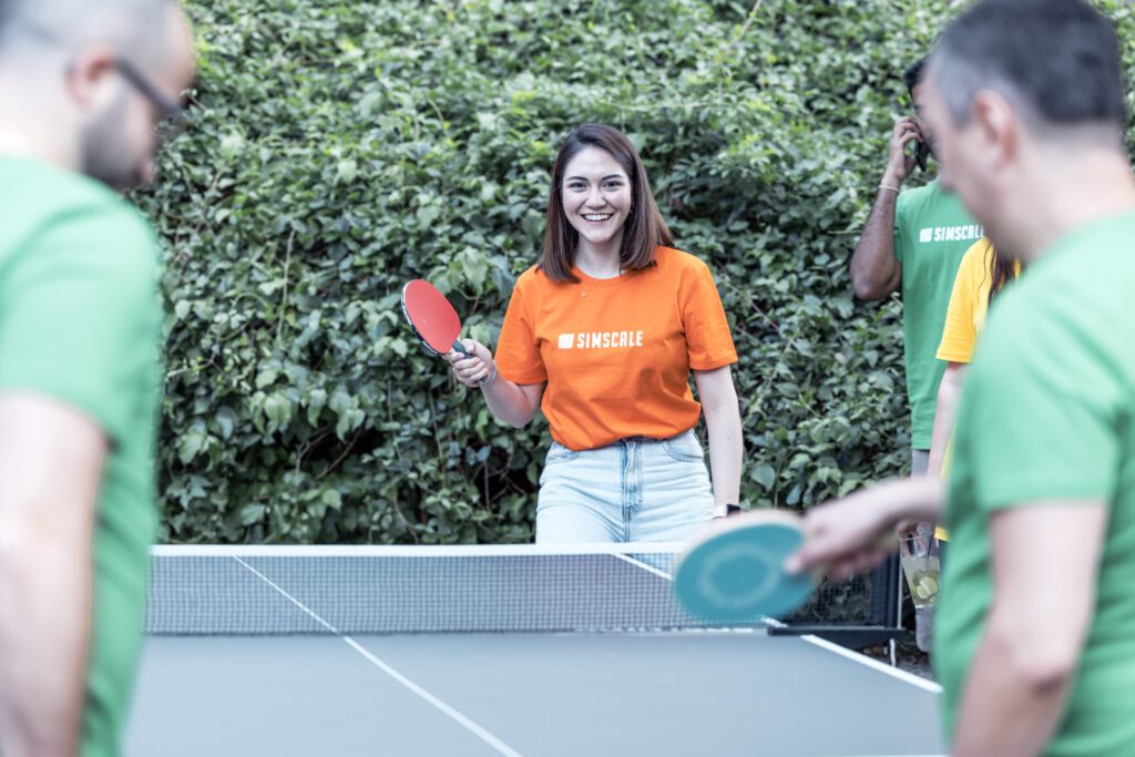 SimScale employees playing table tennis during a company outing