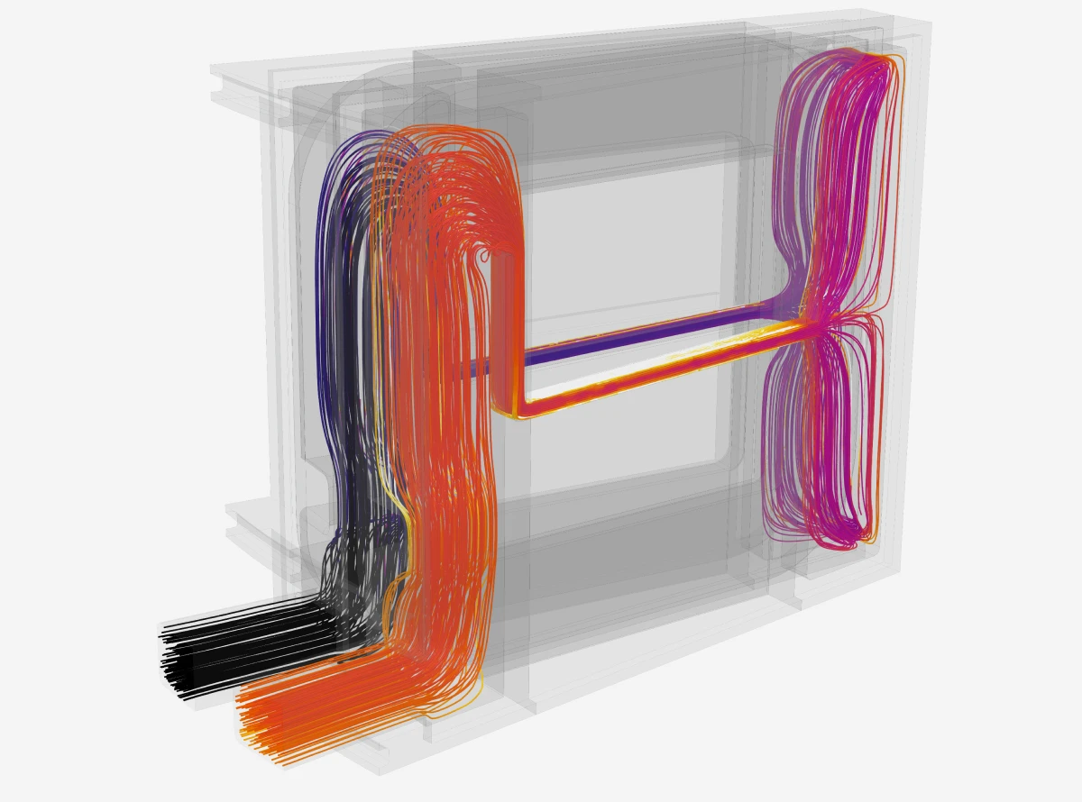 Streamlines showing oil cooling flow through a pair of stator segments (streamlines colored by Temperature)