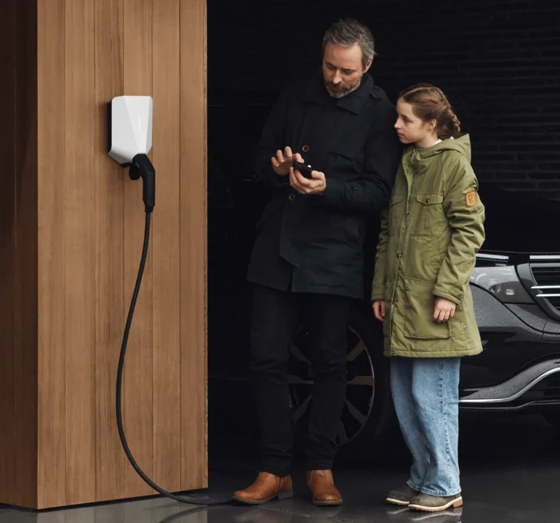 EASEE’s charging robot mounted to an exterior wall exposed to the elements