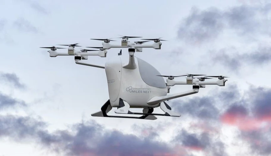 Concept Integrity air taxi flying with clouds in the background